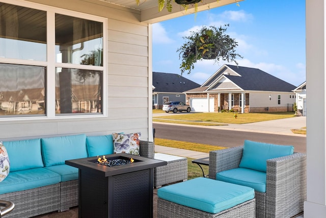 view of patio / terrace with an outdoor living space with a fire pit