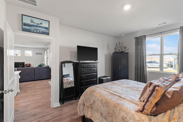 bedroom with light hardwood / wood-style flooring