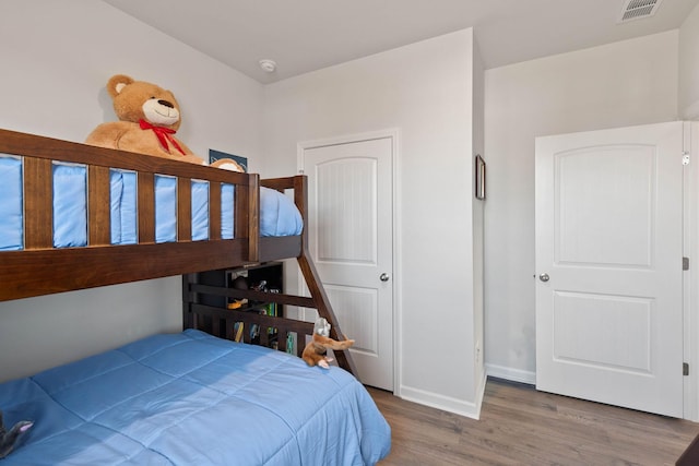 bedroom with hardwood / wood-style floors