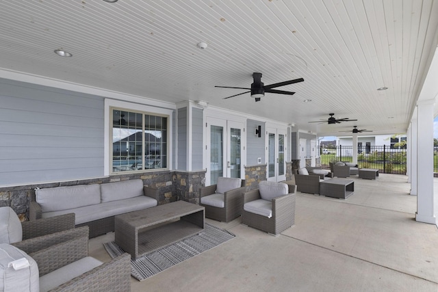 view of patio featuring an outdoor living space, french doors, and ceiling fan