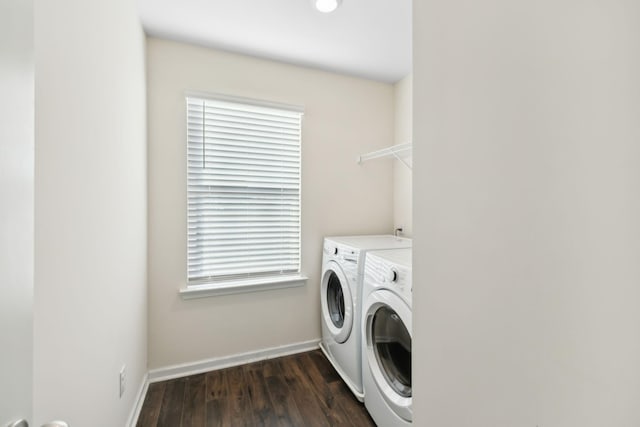 washroom featuring dark hardwood / wood-style flooring and washing machine and dryer