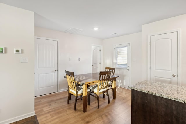 dining room featuring wood-type flooring