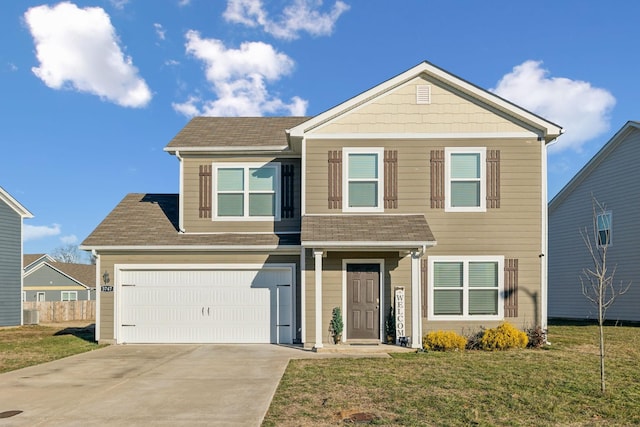 view of front of property featuring a garage and a front lawn