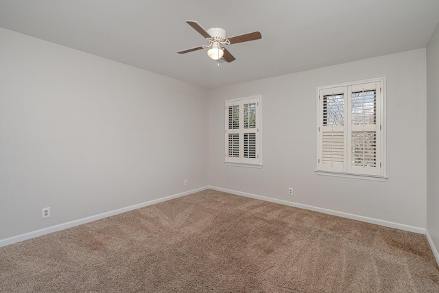 empty room with carpet floors and ceiling fan