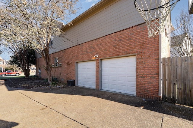 view of side of home featuring a garage