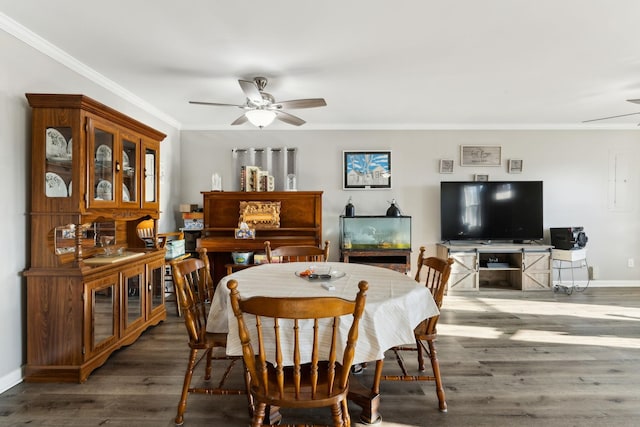 dining area with ornamental molding, dark wood-type flooring, and ceiling fan