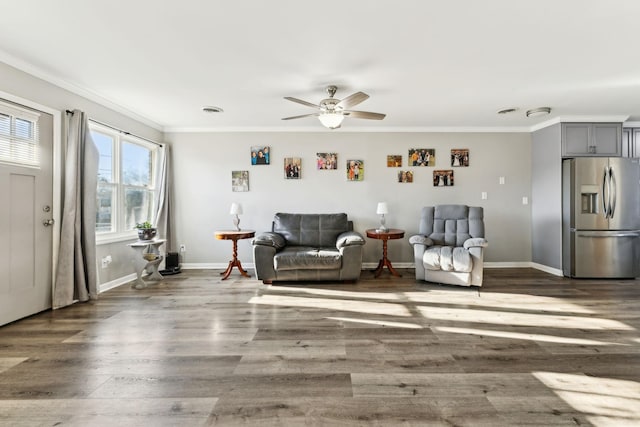 sitting room featuring crown molding, dark hardwood / wood-style floors, and ceiling fan