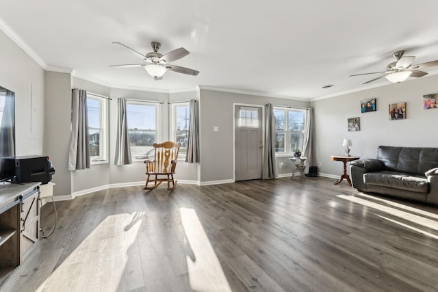 living room with ornamental molding, dark hardwood / wood-style floors, and ceiling fan