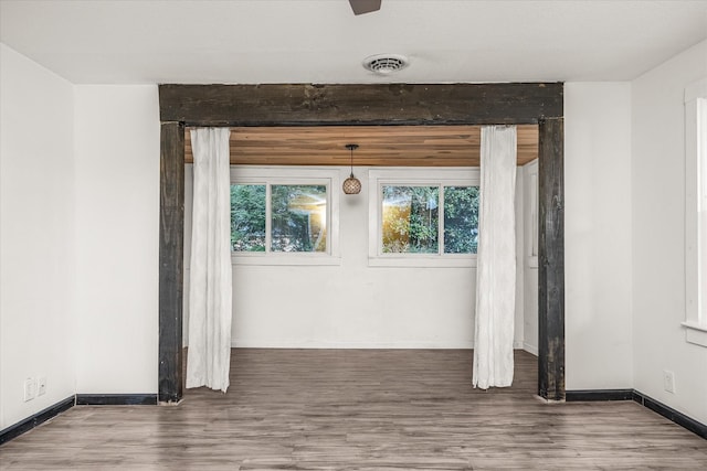 unfurnished room with hardwood / wood-style floors