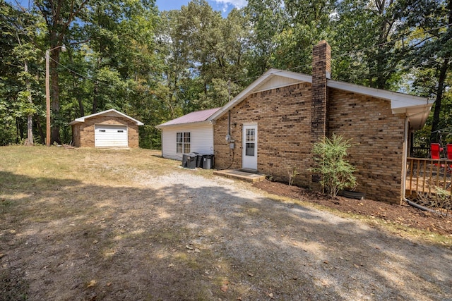 view of side of property with an outbuilding and a garage