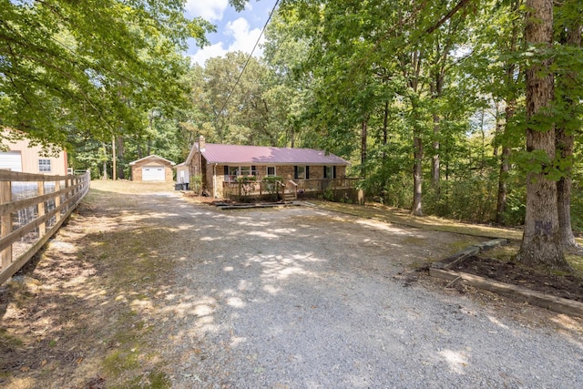 view of front of house featuring a garage and an outdoor structure