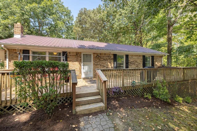 ranch-style house with a wooden deck