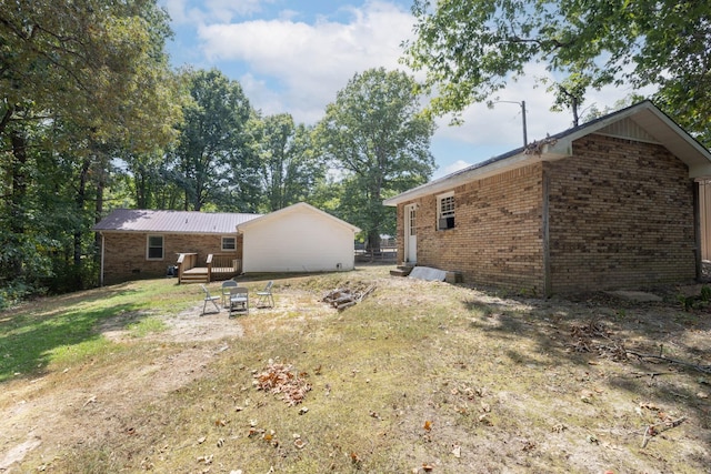 view of yard with a fire pit