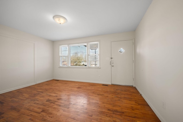 foyer with wood-type flooring