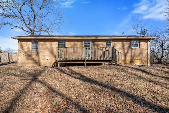 rear view of house featuring a deck