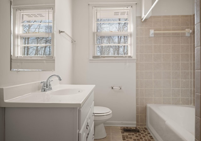 full bathroom featuring vanity, tile patterned floors, toilet, and shower / bath combination