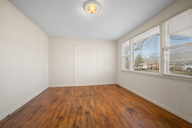 empty room featuring dark hardwood / wood-style floors