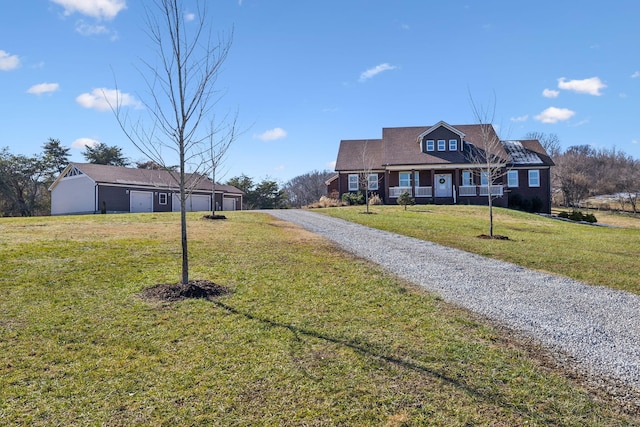 view of front of house featuring a front yard and covered porch