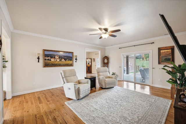 living area with ornamental molding, ceiling fan, and light hardwood / wood-style floors