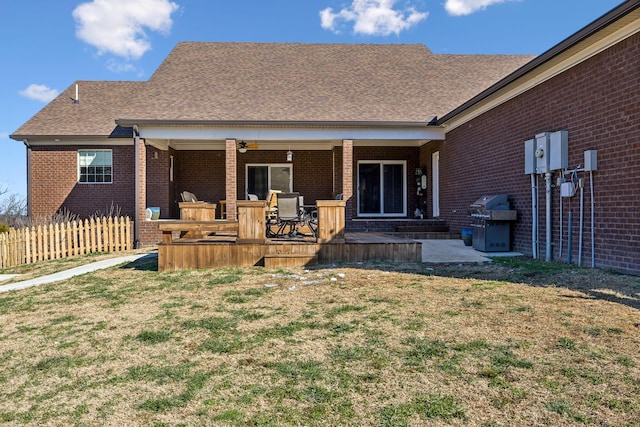 back of house with a yard