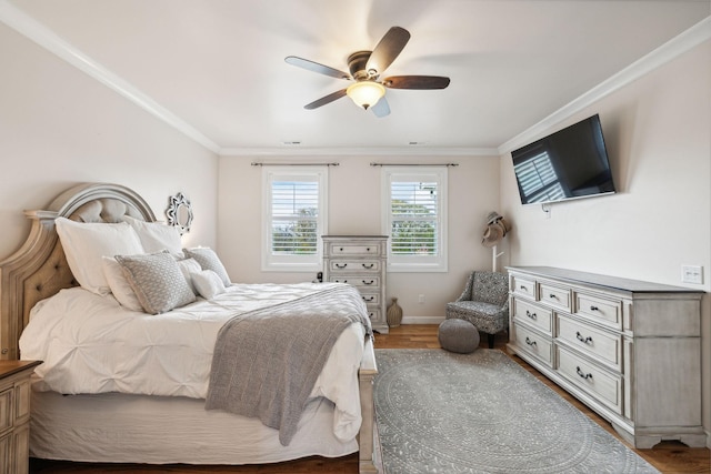 bedroom with crown molding, ceiling fan, and hardwood / wood-style floors