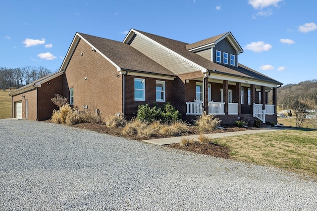 view of front facade featuring a garage and covered porch