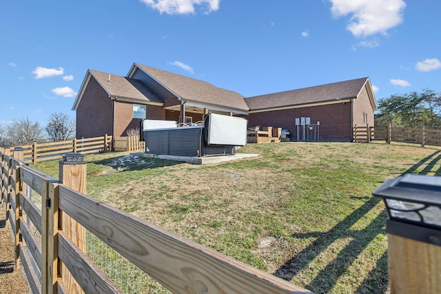 view of side of property featuring a lawn