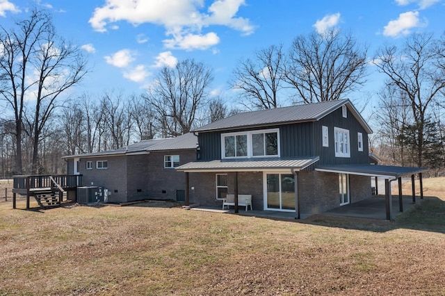 back of house featuring a patio, a yard, central AC, and a deck