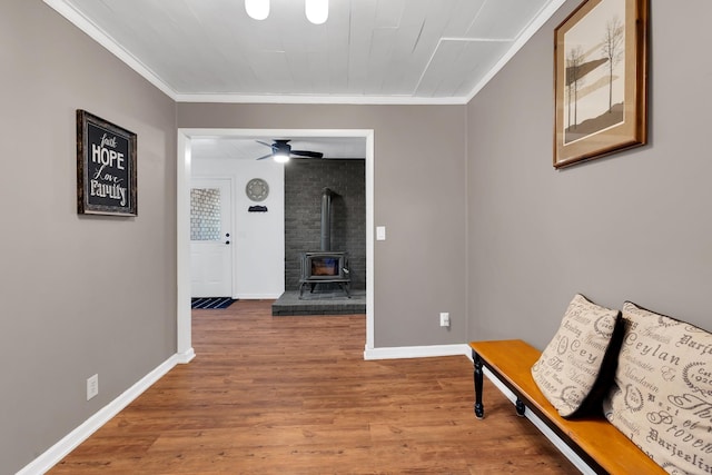 corridor with crown molding and hardwood / wood-style floors