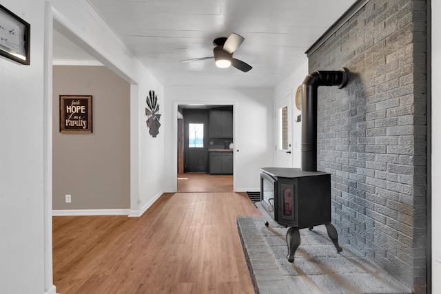 hallway with brick wall and wood-type flooring