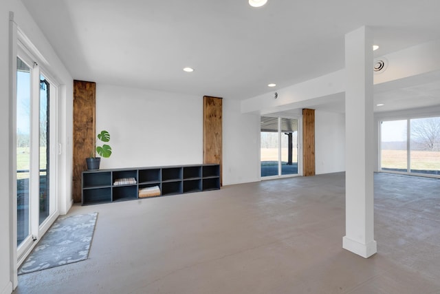 living room featuring concrete floors