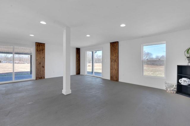 unfurnished living room with plenty of natural light