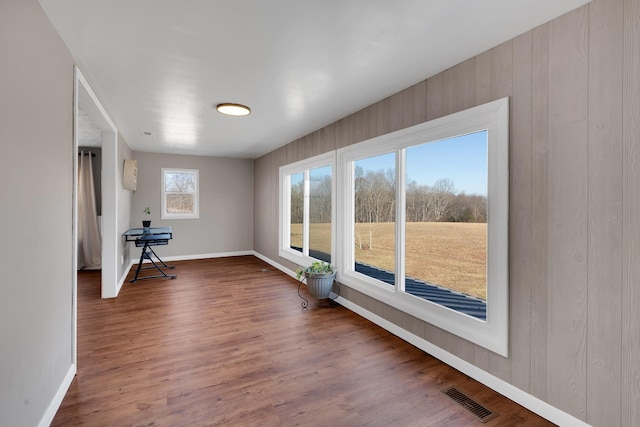 unfurnished room featuring dark hardwood / wood-style flooring