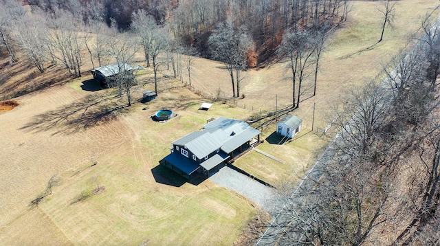 birds eye view of property featuring a rural view