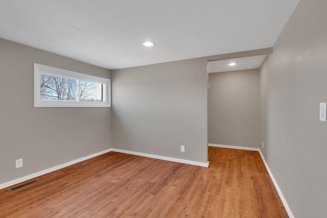 spare room featuring light hardwood / wood-style floors