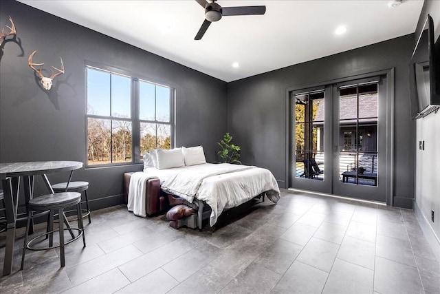 bedroom featuring multiple windows, access to exterior, ceiling fan, and french doors