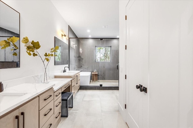 bathroom featuring tile patterned floors, vanity, and shower with separate bathtub