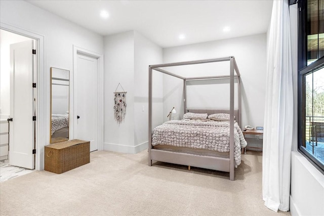 bedroom with light colored carpet