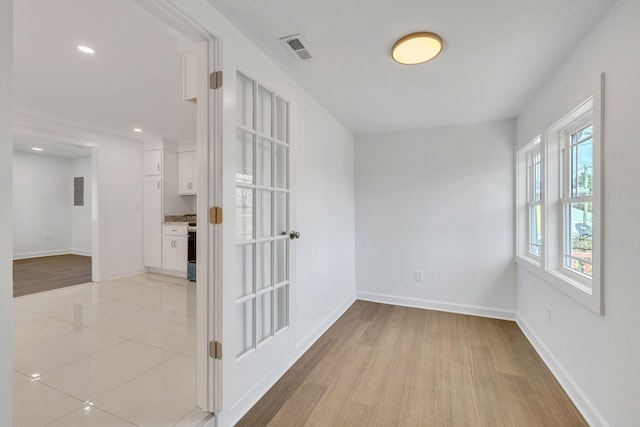 spare room with light wood-type flooring