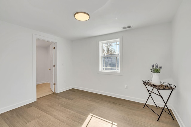 unfurnished room featuring light wood-type flooring