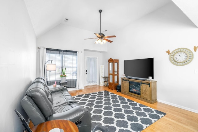 living room with ceiling fan, high vaulted ceiling, and hardwood / wood-style floors