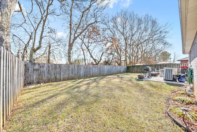 view of yard featuring cooling unit and a patio area