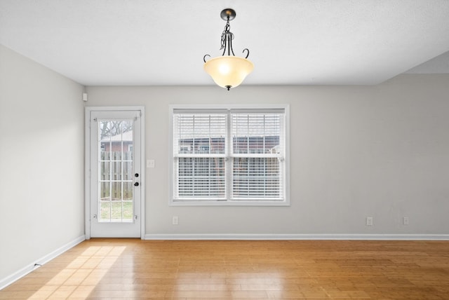 interior space with light wood-type flooring and baseboards