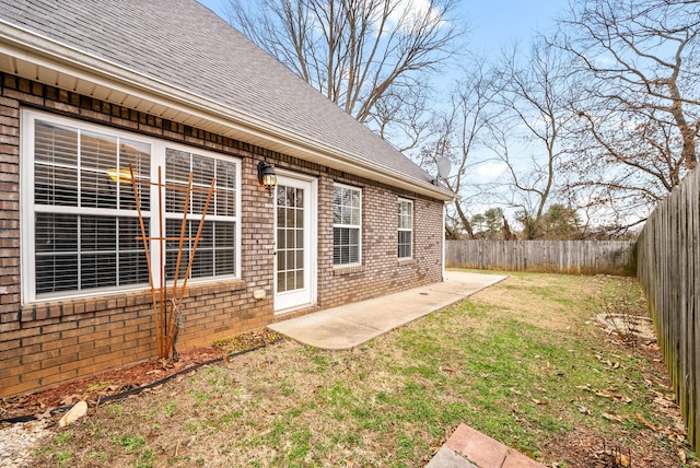 view of yard featuring a patio area and a fenced backyard