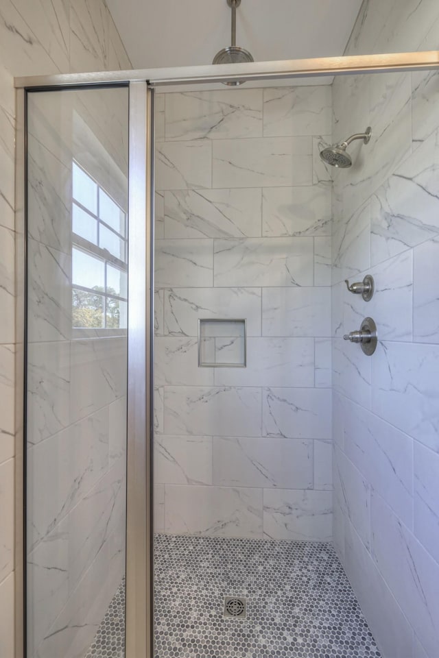 bathroom featuring an enclosed shower