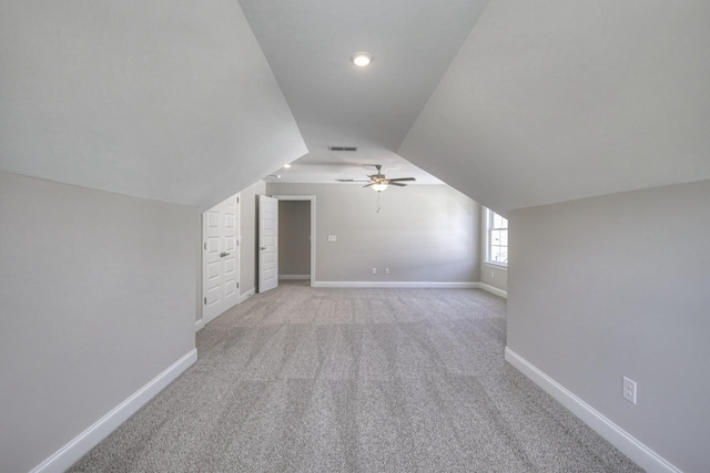 bonus room featuring vaulted ceiling, light colored carpet, and ceiling fan