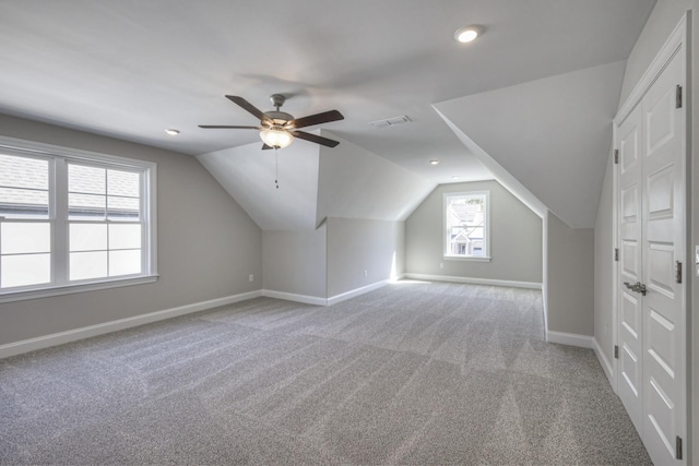 bonus room with ceiling fan, lofted ceiling, and carpet flooring