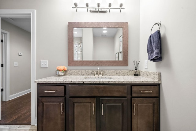 bathroom with vanity and hardwood / wood-style floors