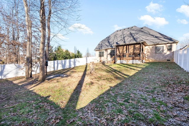 view of yard featuring a sunroom