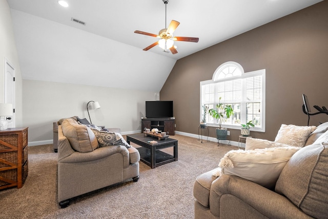 carpeted living room with vaulted ceiling and ceiling fan